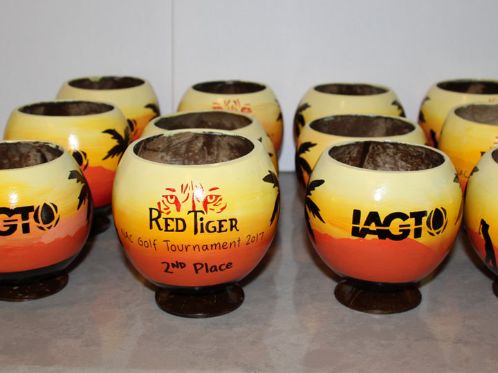 Coconut cups painted on both sides with multiple logos for a unique trophy